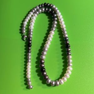 Beautiful mother of pearl necklace with sterling silver clasp.